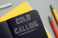COLD CALLING inscription on the piece of paper. Cold callingÃÂ typically refers to solicitation by phone or telemarketing